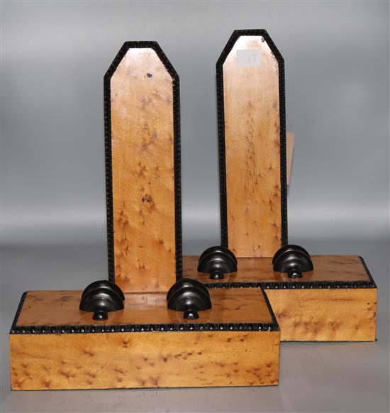 A pair of maple plate stands